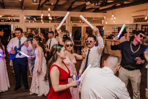 Wedding guests dancing on the dance floor at The Farmhouse